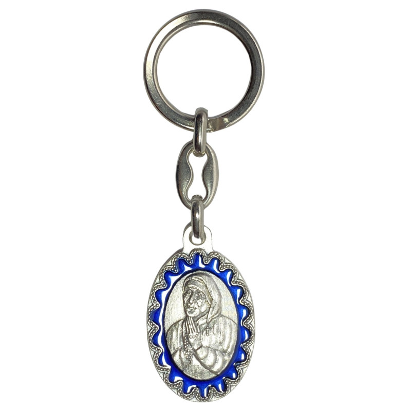 Face avant porte-clés ovale Mère Térésa métal argenté émaillé bleu H.3,8cm